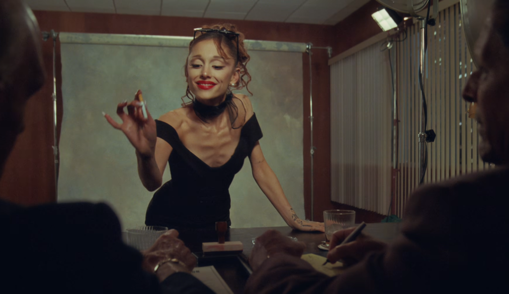 Ariana puts cigarette out in executives drink